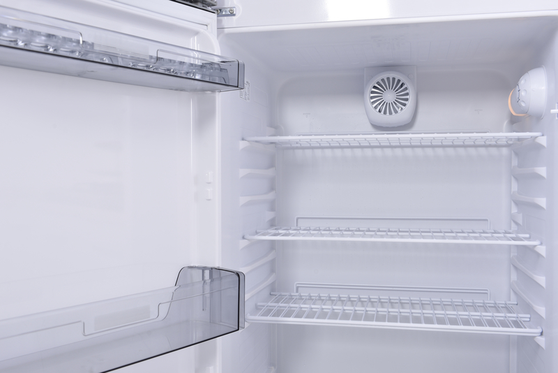 Inside of an empty clean fridge